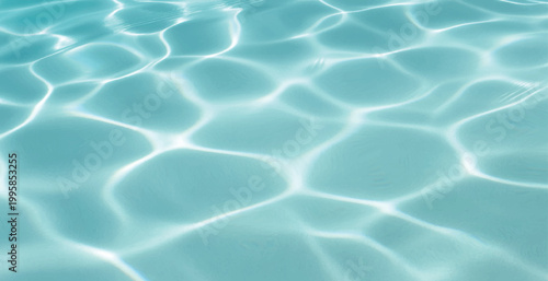 Serene Aqua Water Surface with Gentle Ripples, Bright Sunlight Reflections, Crystal Clear Pool Water Background with Light Patterns