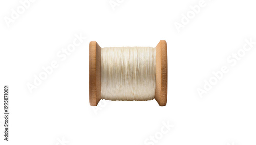 Photos Wooden spool with white thread neatly wound around it