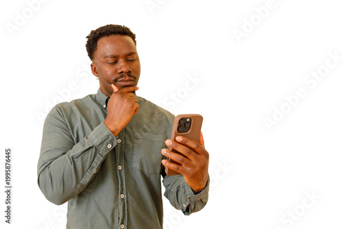 Tablou pe pânză African american man in casual shirt thinking while holding smartphone, deciding
