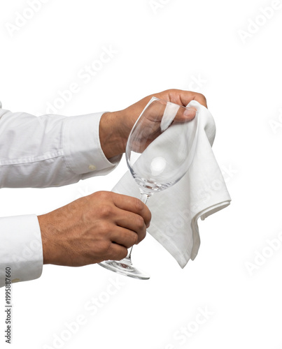 Bartender hands polishing a clean wine glass with a white cloth