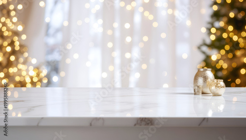 Marble countertop with golden holiday bokeh lights and small ornament.