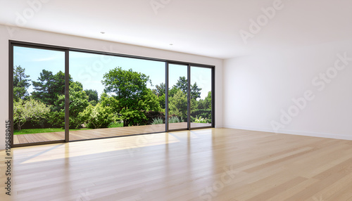 Empty modern living room with large sliding glass doors overlooking green garden.