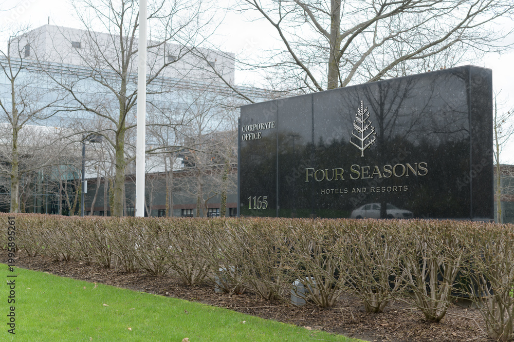 Naklejka premium stone road-side sign outside global headquarters of Four Seasons Hotels at 1165 Leslie St; a Canadian-founded luxury brand managed from Toronto, April 2026