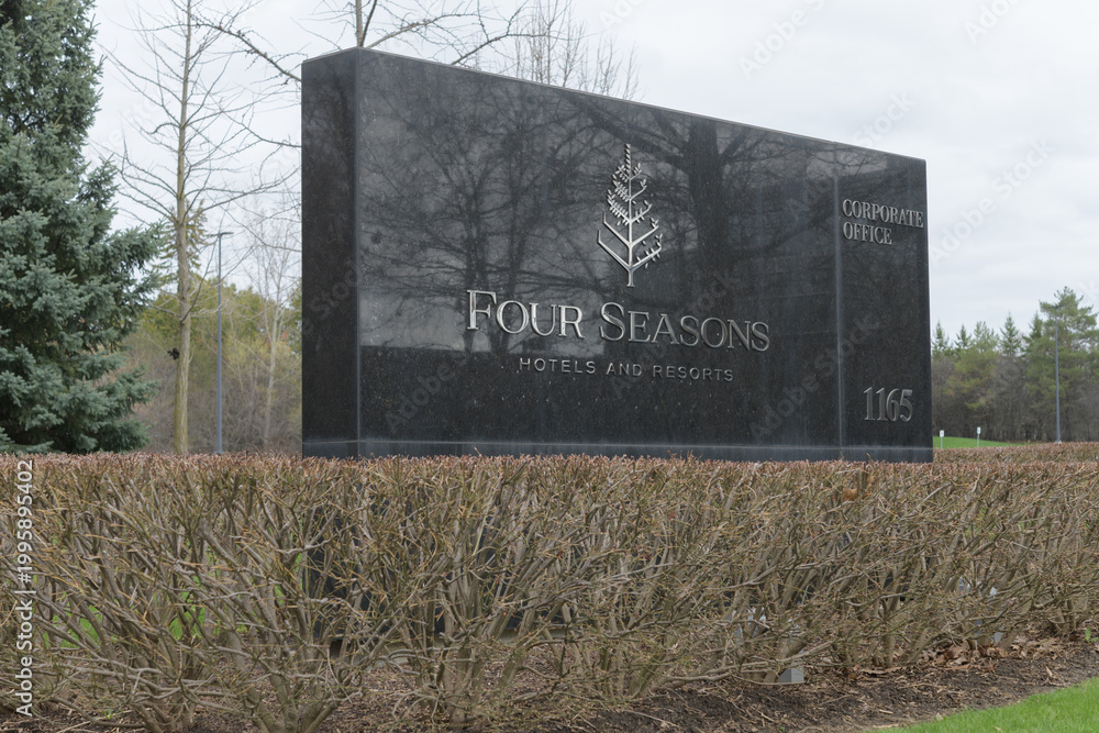 Fototapeta premium stone road-side sign outside global headquarters of Four Seasons Hotels at 1165 Leslie St; a Canadian-founded luxury brand managed from Toronto, April 2026
