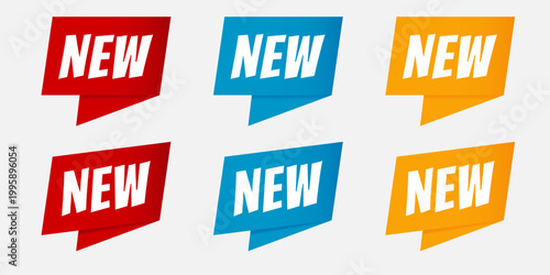 New arrival ribbon banner set isolated on white. Red, blue and yellow vector labels for product promotion and marketing. Modern announcement tags for web and retail shops