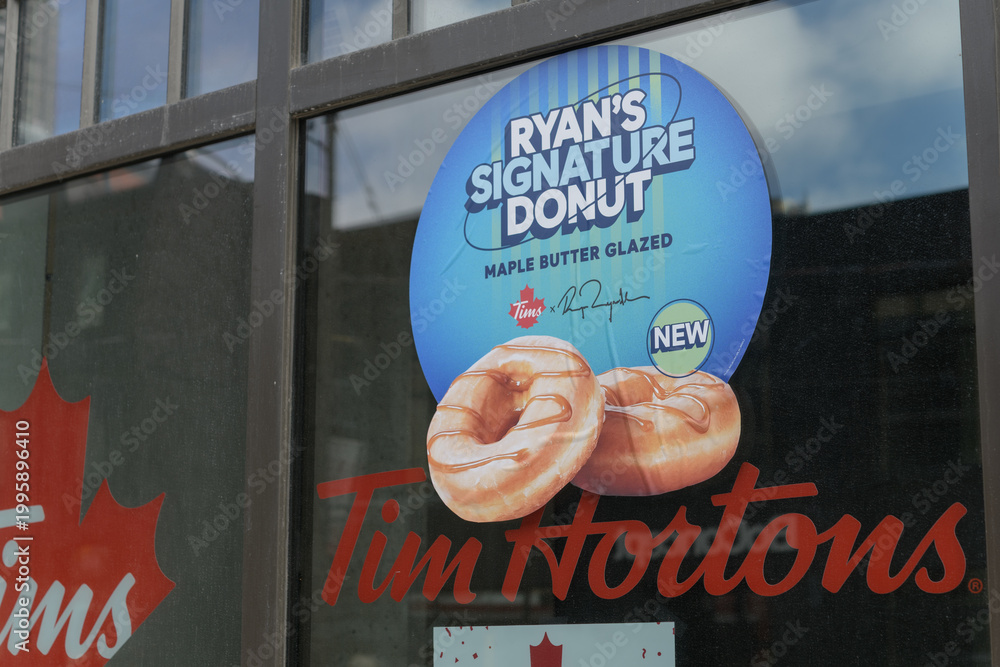 Fototapeta premium window sign at Tim Hortons for Ryan's Signature Donut, Toronto