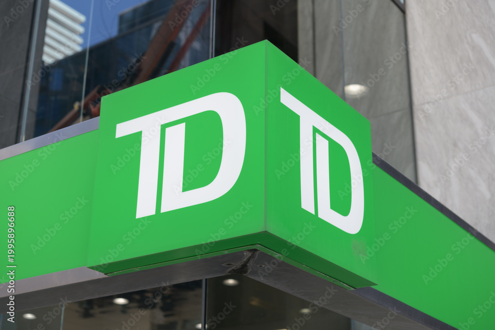 Obraz premium corporate logo of Toronto Dominion bank sign outside a branch in Toronto