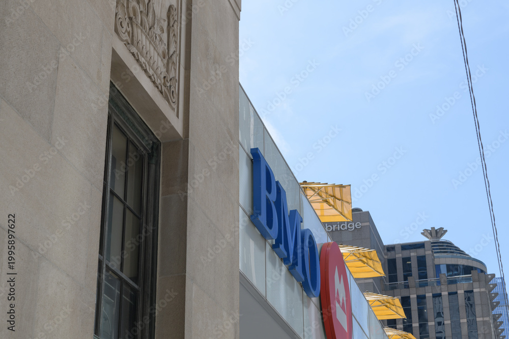 Obraz premium oblique angle view of sign and corporate logo outside BMO, Bank of Montreal, Adelaide St W side, Toronto