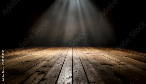 Dramatic spotlight illuminating rustic wooden stage floor.