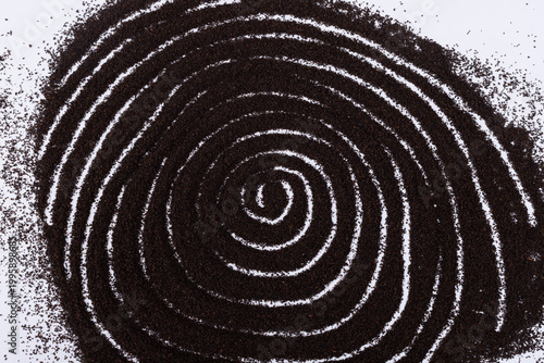 The spiral patterns formed by the black tea powder