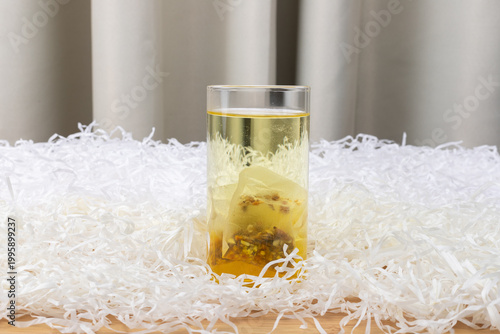 Red bean, jujube and red sorghum tea in a glass cup