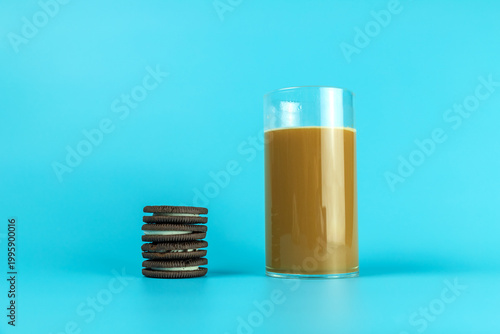 A coffee drink contained in a glass on a plain background