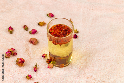 The water made from dried red dates and goji berries in the transparent glass cup