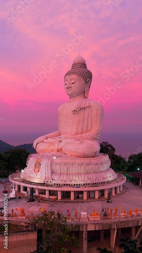 The Big Buddha on the mountaintop, combined with the view of the sunrise in the morning, is a very beautiful view in Phuket province, southern Thailand.