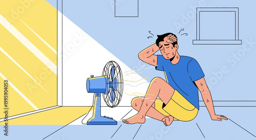 Man suffering from heat, sitting in front of a fan, feeling hot and sweating