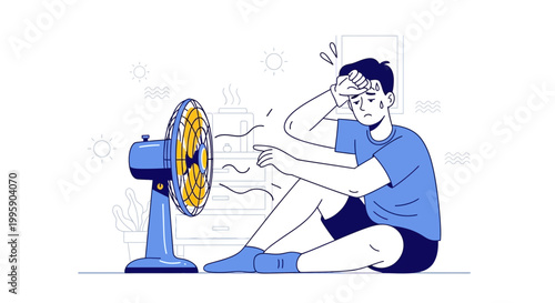 Man suffering from heat, sitting in front of a fan, sweating, feeling hot and uncomfortable