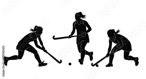 Three female field hockey players in dynamic action, skillfully maneuvering the ball during a competitive game.
