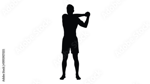 Silhouette of a man performing a medicine ball slam exercise during a workout