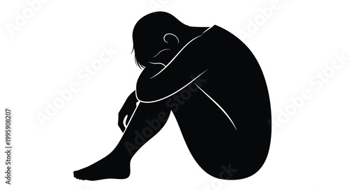 Silhouette of a person huddled in despair embodying isolation and emotional distress
