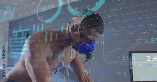 Fotografie Leaning shirtless male participant wearing blue respiratory mask and electrodes