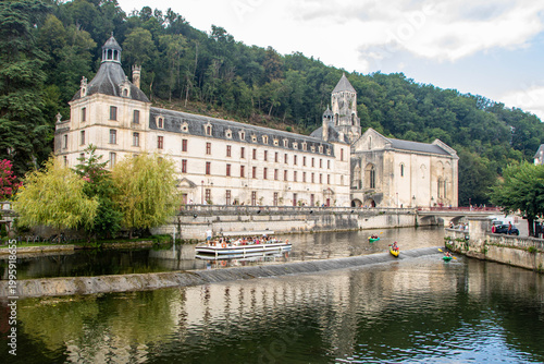 Panoramic view of Brantome Abbey and Dronne river with boats