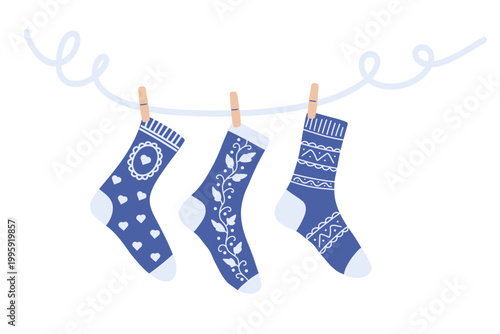 Blue winter socks set hanging on rope cozy seasonal laundry scene