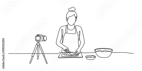 Woman cooking food for video blog with camera on tripod