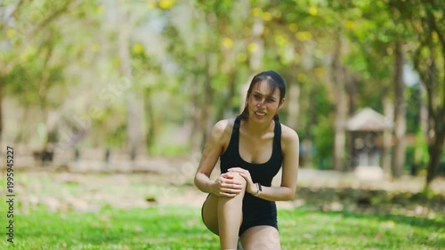 Young athletic woman running in park during outdoor workout, healthy lifestyle and fitness training concept.