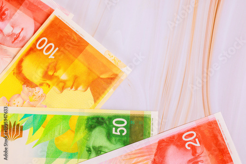 Schilderij op canvas Several currency New Israeli shekel NIS banknotes in different denominations are