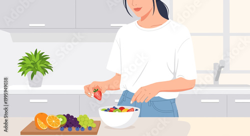 Woman preparing fresh fruit salad in a modern kitchen, healthy eating and lifestyle