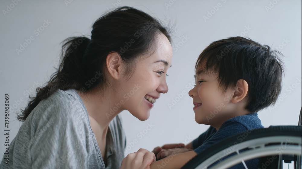 Obraz premium Close-up of mother and young child smiling face to face, emotional bond, love and parenting concept.
