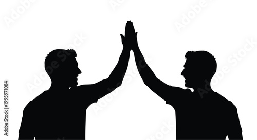 Two silhouetted men give a high five, celebrating success and teamwork.