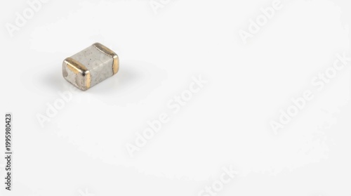 gold electronic surface mount device smd microchip on white background closeup