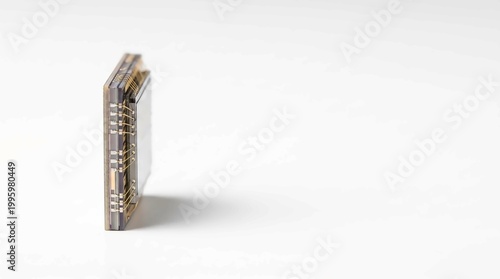 Stacked gold electronic connectors isolated on white background close-up