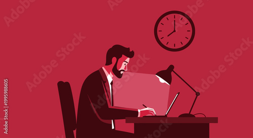 Businessman working late on laptop at desk with clock