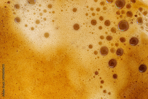 Φωτογραφία Espresso crema background Close-up top view Golden brown coffee foam with bubble