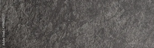 Panel kuchenny z motywem Dark gray slate background presenting a rough stone texture with a natural rocky surface, creating a rugged and weathered wall effect
