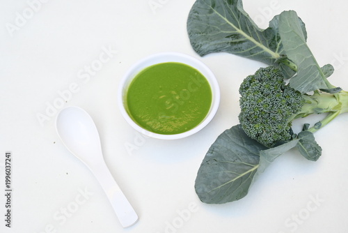 Broccoli soup on white background. It is just as nutritious as it is visually appealing. Crafted into a perfectly smooth, silky, and emerald-green puree, it delivers the fresh taste of green vegetable