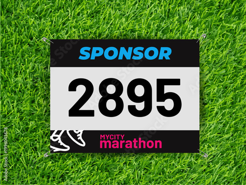 Fotografija Running race bib mockup with safety pins on grass texture