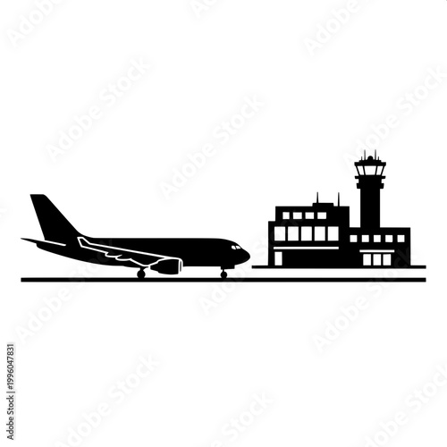 Commercial airplane landing at airport with control tower in silhouette