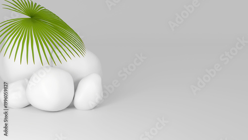 A minimalist scene with smooth stones and palm branches on a light background with free space. An elegant tropical composition for product presentation and design.