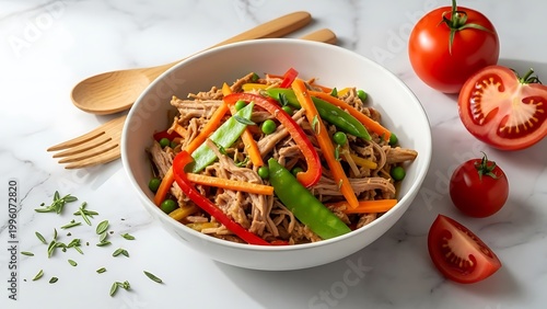 Delicious Asian noodle salad with vegetables and herbs on marble