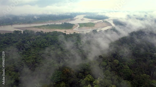 Aerial shot at dawn looking over the misty Rio Napo flowing through the Ecuadorian Amazon