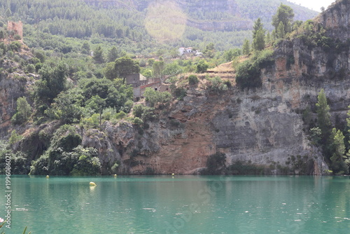 Ancient Watchtower and Rural Houses on Limestone Cliffs in Cortes de Pallas