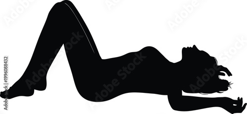 Silhouette of a woman reclining with legs raised in a yoga pose