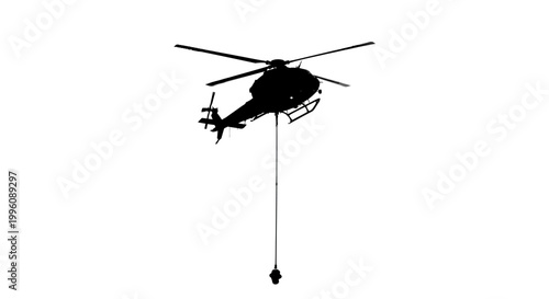 Black helicopter lifting heavy load.