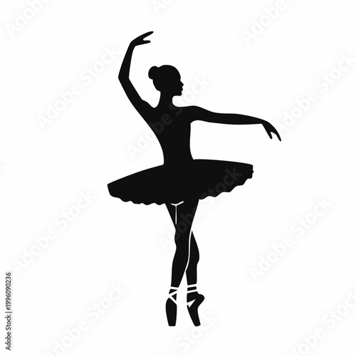Silhouette of a ballerina in pointe shoes performing a ballet pose