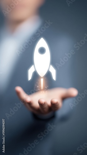 Businessman Hand Holding Glowing Rocket Icon Startup Launch and Business Growth Concept