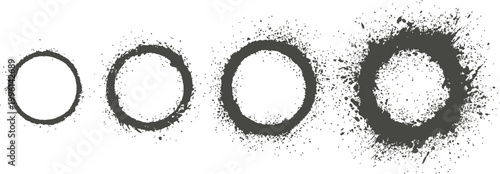 Set of four black grunge circular rings with increasing spray splatter texture
