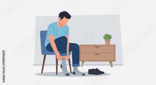 Man sitting on chair putting on socks and shoes, getting ready for the day